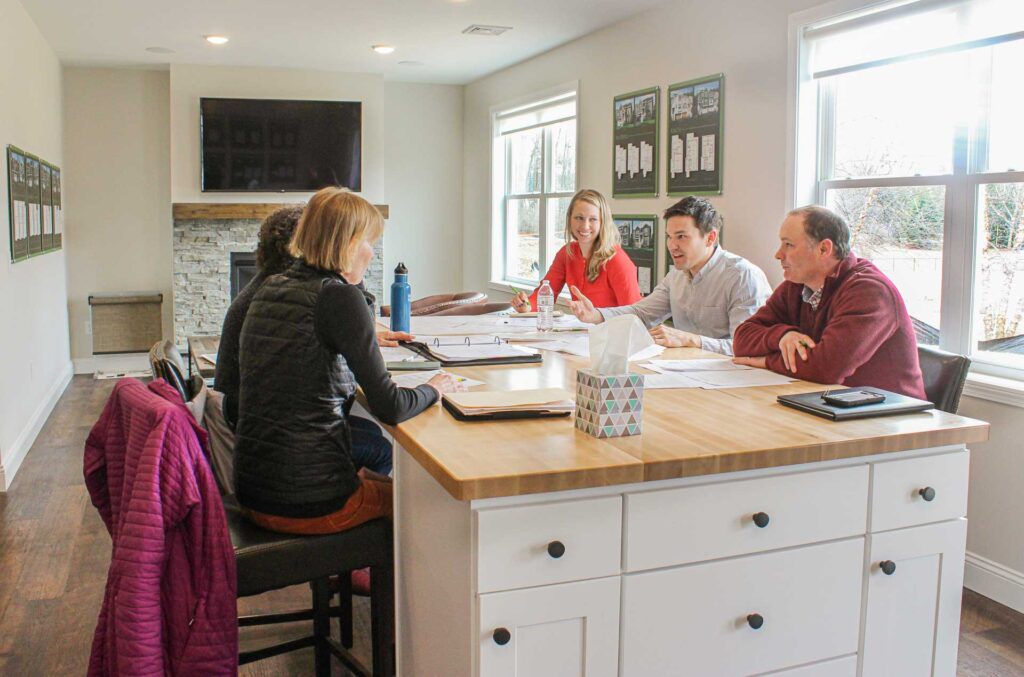 Group of Hillside buyers and designers sitting around a table talking