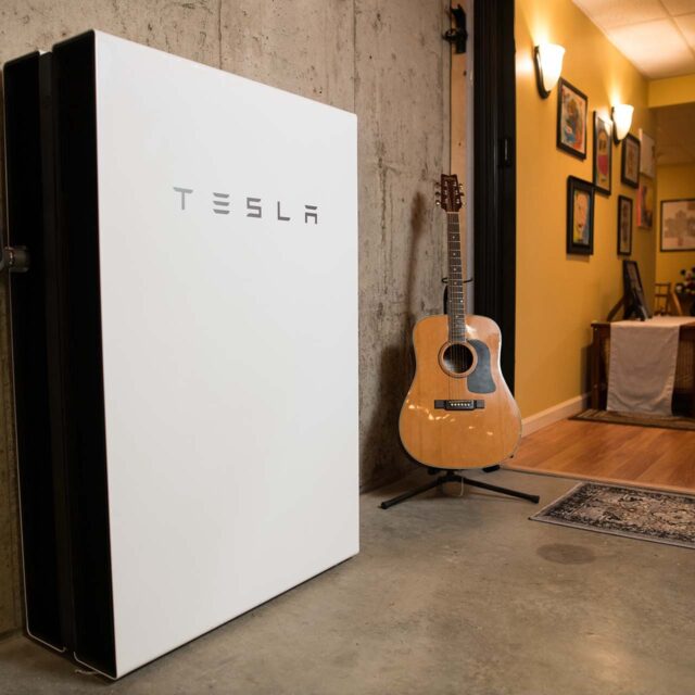 powerwall w guitar in partially finished basement